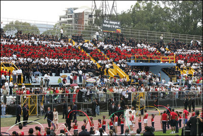 People sitting in the pattern of the Costa Rican flag fill the stands as President-elect Oscar Arias walks in a procession as part of his inaugural ceremony at the Estadio Nacional in San Jose, Costa Rica, Monday, May 8, 2006.