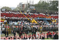 People sitting in the pattern of the Costa Rican flag fill the stands as President-elect Oscar Arias walks in a procession as part of his inaugural ceremony at the Estadio Nacional in San Jose, Costa Rica, Monday, May 8, 2006.