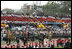 People sitting in the pattern of the Costa Rican flag fill the stands as President-elect Oscar Arias walks in a procession as part of his inaugural ceremony at the Estadio Nacional in San Jose, Costa Rica, Monday, May 8, 2006.