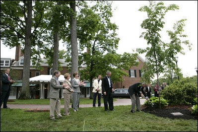 President George W. Bush and Australian Prime Minister John Howard participate in the presentation of White House trees at the Australian Ambassador's Residence, Sunday, May 14, 2006.