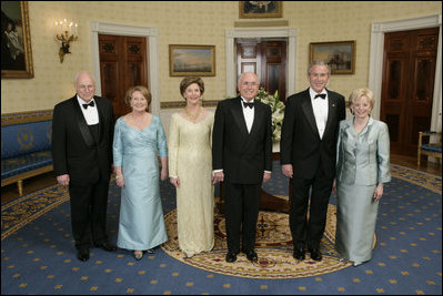 President George W. Bush, Laura Bush, Vice President Dick Cheney and Lynne Cheney stand with Australian Prime Minister John Howard and his wife Mrs. Janette Howard in the Blue Room for a photograph during the official dinner Tuesday, May 16, 2006.