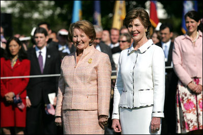 Mrs. Laura Bush and the wife of Australian Prime Minister John Howard Janette Howard stand during the State Arrival Ceremony on the South Lawn of The White House May 16, 2006.