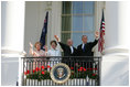 President George W. Bush, Prime Minister John Howard, Mrs. Laura Bush and Mrs. Janette Howard wave from the South Portico of the White House during the State Arrival Ceremony on the South Lawn Tuesday, May 16, 2006.