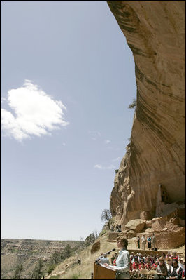 Mrs. Laura Bush speaks from Long House cliff dwelling, Thursday, May 23, 2006, in the western portion of Mesa Verde National Park, Mesa Verde, Colo. Long House was excavated between 1959 and 1961 as part of the Westerill Mesa Archeological Project.