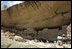 Mrs. Laura Bush talks to a crowd, Thursday, May 23, 2006, assembled in Long House cliff dwellings during a celebration of the 100th anniversary of Mesa Verde and the Antiquities Act in Mesa Verde, Colo. Mesa Verde was the first national park established to protect America's man-made treasures; and Long House is the second largest cliff dwelling in the park.