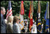 Mrs. Bush stands with Health and Human Services Secretary Mike Leavitt during a Memorial Day wreath laying ceremony at the Tomb of the Unknowns in Arlington National Cemetery in Arlington, Va., Monday, May 29, 2006.