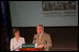 Mrs. Laura Bush listens to Richard Moe, President of the National Trust for Historic Preservation, Wednesday, May 31, 2006. Mr. Moe introduced Mrs. Bush during a historic preservation summit at Tulane University in New Orleans.