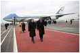 President George W. Bush and Laura Bush walk the red carpet with Russia's President Vladimir Putin and Lyudmila Putina after their arrival Wednesday, Nov. 15, 2006, at Vnukovo Airport in Moscow.