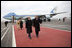 President George W. Bush and Laura Bush walk the red carpet with Russia's President Vladimir Putin and Lyudmila Putina after their arrival Wednesday, Nov. 15, 2006, at Vnukovo Airport in Moscow.