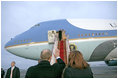 President George W. Bush and Mrs. Laura Bush wave goodbye to President Vladimir Putin and Mrs. Lyudmila Putina after a brief visit Wednesday, Nov. 15, 2006, in Moscow before heading to Singapore.