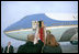 President George W. Bush and Mrs. Laura Bush wave goodbye to President Vladimir Putin and Mrs. Lyudmila Putina after a brief visit Wednesday, Nov. 15, 2006, in Moscow before heading to Singapore.