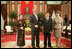 President George W. Bush and Mrs. Laura Bush join Viet President Nguyen Minh Triet and Mrs. Tran Thi Kim Chi in the Great Hall of the Presidential Palace Friday, Nov. 17, 2006, after arriving in Hanoi for the 2006 APEC Summit.