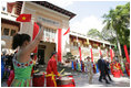 President George W. Bush and Mrs. Laura Bush are greeted upon their visit Monday, Nov. 20, 2006, to the the Ho Chi Minh City History Museum.