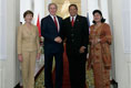 President George W. Bush and Mrs. Laura Bush are greeted by President Susilo Bambang Yudhoyono of Indonesia and Herawati Yudhoyono at the Presidential Palace in Bogor, Indonesia, after arriving in the country for a six-hour visit Monday, Nov. 20, 2006.