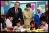 President George W. Bush and Mrs. Laura Bush pose with 6th graders during a drop-by education event Monday, Nov. 20, 2006, at the Bogor Palace in Bogor, Indonesia.