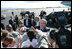 President George W. Bush and Laura Bush shake hands with military personnel as they prepare to depart Honolulu, Hawaii, Tuesday, Nov. 21, 2006, for their flight home to Washington, D.C., following their eight-day trip to Asia.