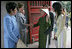 Mrs. Laura Bush is greeted as she arrives at the Temple of Literature in Hanoi Saturday, Nov. 18, 2006, for a tour with the spouses of APEC leaders.