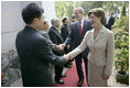 Mrs. Laura Bush is greeted as she and President George W. Bush arrive for church services Sunday, Nov. 19, 2006, at Cua Bac Church in Hanoi.