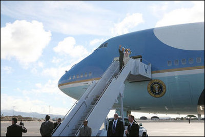 President George W. Bush and Laura Bush wave as they depart Honolulu, Hawaii, Tuesday, Nov. 21, 2006, for their flight home to Washington, D.C., following their eight-day trip to Asia.