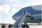 President George W. Bush and Laura Bush wave as they depart Honolulu, Hawaii, Tuesday, Nov. 21, 2006, for their flight home to Washington, D.C., following their eight-day trip to Asia.