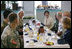 Mrs. Laura Bush is joined by Mary Fallon, left, wife of Navy Admiral William J. Fallon the Commander of the U.S. Pacific Command, during breakfast with military personnel Tuesday, Nov. 21, 2006, at the Officers Club at Hickam Air Force Base in Honolulu, Hawaii.