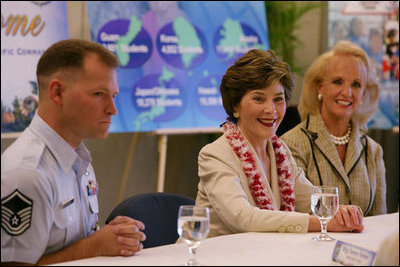 Mrs. Laura Bush is joined by Mary Fallon, right, wife of Navy Admiral William J. Fallon the Commander of the U.S. Pacific Command, during a roundtable discussion with military personnel Tuesday, Nov. 21, 2006, on military housing and educational services provided to families stationed in Honolulu, Hawaii.