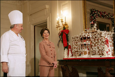 Mrs. Laura Bush and former chef Roland Mesnier discuss the gingerbread White House with the press in the State Dining Room Thursday, Nov. 30, 2006. The house consists of more than 300 pounds of dark chocolate and gingerbread.