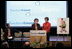 Mrs. Laura Bush stands with her second grade teacher, Charlene Gnagy, as Mrs. Gnagy speaks to the audience Thursday, October 5, 2006, during the TeachersCount "Behind every famous person is a fabulous teacher" PSA campaign launch ceremony in New York City. The campaign is to help create awareness for teachers and the role they play in the lives of children and to raise the status of the teaching profession.