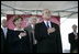 President George W. Bush and Mrs. Laura Bush stand for the National Anthem during the Christening Ceremony of the George H.W. Bush (CVN 77) in Newport News, Virginia, Saturday, Oct. 7, 2006.