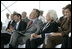 Former President George H. W. Bush and First Lady Barbara Bush react during remarks by President George W. Bush during the Christening Ceremony for the George H.W. Bush (CVN 77) in Newport News, Virginia, Saturday, Oct. 7, 2006.