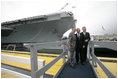 President George W. Bush, father President George H. W. Bush and brother Florida Governor Jeb Bush depart at the conclusion of the Christening Ceremony for the George H.W. Bush (CVN 77) in Newport News, Virginia, Saturday, Oct. 7, 2006.