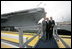 President George W. Bush, father President George H. W. Bush and brother Florida Governor Jeb Bush depart at the conclusion of the Christening Ceremony for the George H.W. Bush (CVN 77) in Newport News, Virginia, Saturday, Oct. 7, 2006.