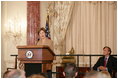 Newly sworn-in Ambassador Mark Dybul, Coordinator of the Office of the US Global AIDS, looks at Mrs. Laura Bush as she speaks to an audience of Ambassadors to the United States, government officials, representatives from the public health sector and Non-Governmental Organizations Tuesday, October 10, 2006, during the swearing-in ceremony of Ambassador Mark Dybul in the Benjamin Franklin Room at the US Department of State in Washington, D.C. Ambassador Dybul will coordinate and oversee the US global response to HIV/AIDS, and lead implementations of the US President's Emergency Plan for AIDS Relief (Emergency Plan/PEPFAR), the largest commitment ever by any nation for an international health initiative dedicated to a single disease.