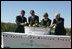 Mrs. Laura Bush is joined by, from left, U.S. Department of Agriculture Secretary Mike Johanns; John Rosenow, president of the National Arbor Day Foundation, and Andy Taylor, chairman and CEO of Enterprise Rent-A-Car, as they plant White Pine saplings Thursday, October 11, 2006, during a ceremony for the Enterprise 50 Million Tree Pledge in St. Louis, Missouri. Enterprise Rent-A-Car donated $50 million to the National Arbor Day Foundation to plant 50 million trees in National Forests over the next 50 years. The White Pine saplings planted at the ceremony will be re-planted permanently in the Mark Twain National Forest in southern Missouri.