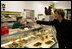 Mrs. Laura Bush purchases a box of homemade chocolates Tuesday, October 24, 2006, at Seroogy's, a family owned business that has been making chocolates for more than a hundred years in De Pere, Wisconsin.