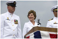 Mrs. Laura Bush smiles at Master Chief (SS) Mark K. Brooks, Command Master Chief, USS Texas, Saturday, September 9, 2006, after delivering remarks and giving the traditional command: "Man your ship and bring it to life!", during the Commissioning Ceremony in Galveston, Texas. Mrs. Bush participated in the christening of ship on July 31, 2004.