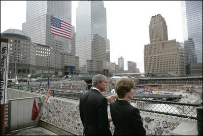 President George W. Bush and Laura Bush look over the World Trade Center site Sunday, September 10, 2006, during a visit to Ground Zero in New York City to mark the fifth anniversary of the September 11th terrorist attacks.