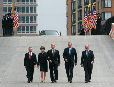 President George W. Bush and Laura Bush walk with New York City Mayor Michael Bloomberg, far left, New York Governor George Pataki, second from right, and former New York City Mayor Rudolph Giuliani down the entrance ramp to Ground Zero at the World Trade Center site in New York City Sunday, Sept. 10, 2006.