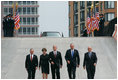 President George W. Bush and Laura Bush walk with New York City Mayor Michael Bloomberg, far left, New York Governor George Pataki, second from right, and former New York City Mayor Rudolph Giuliani down the entrance ramp to Ground Zero at the World Trade Center site in New York City Sunday, Sept. 10, 2006.