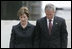 President George W. Bush and Laura Bush stand in silence after laying a wreath in the north reflecting pool at Ground Zero September 10, 2006, in commemoration of the fifth anniversary of the terrorist attacks of September 11, 2001, on the World Trade Center in New York City.