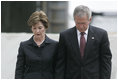 President George W. Bush and Laura Bush stand in silence after laying a wreath in the north reflecting pool at Ground Zero September 10, 2006, in commemoration of the fifth anniversary of the terrorist attacks of September 11, 2001, on the World Trade Center in New York City.