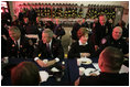 President George W. Bush and Laura Bush join emergency first responders for breakfast Monday morning, Sept. 11, 2006 at the Fort Pitt Firehouse in New York City, during remembrance ceremonies marking the fifth anniversary of the Sept. 11, 2001 attacks.