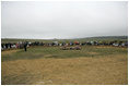 To commemorate the fifth anniversary of the September 11th attacks, family members gather for a wreath laying ceremony Monday, September 11, 2006, in the open field where United flight 93 crashed after passengers rose up against the terrorist hijackers. President George W. Bush and Laura Bush placed a wreath at the crash site.