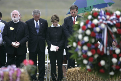 President George W. Bush and Laura Bush stand in silence after placing a wreath to commemorate the fifth anniversary of the September 11th attacks Monday, Sept. 11, 2006, in Shanksvillle, Pa., where United flight 93 crashed after the passengers fought against the terrorist hijackers.