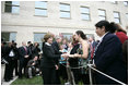 After placing a memorial wreath at the Pentagon, the President and Laura Bush greet audience members Monday, Sept. 11, 2006, during ceremonies marking the fifth anniversary of the September 11th attacks.