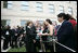 After placing a memorial wreath at the Pentagon, the President and Laura Bush greet audience members Monday, Sept. 11, 2006, during ceremonies marking the fifth anniversary of the September 11th attacks.