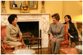 Mrs. Laura Bush talks with Mrs. Kwon Yang-Sook, wife of the President of South Korea, Thursday, September 14, 2006, during a coffee hosted by Mrs. Bush at the White House.