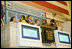 Mrs. Laura Bush is applauded as she stands over the New York Stock Exchange Monday, Sept. 18, 2006, where she visited to highlight literacy's role in extending the benefits of free enterprise to individuals around the world.