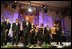 President George W. Bush stands with performers on stage in the East Room Thursday night, Sept. 14, 2006, as he offers closing remarks to guests at the Thelonious Monk Institute of Jazz dinner at the White House.