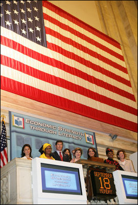 Mrs. Laura Bush raises the gavel signaling the close of trading Monday, Sept. 18, 2006, at the New York Stock Exchange. Mrs. Bush visited the Exchange to highlight literacy's role in extending benefits of free enterprise to individuals around the world.